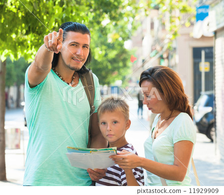 man pointing the direction for family 11929909