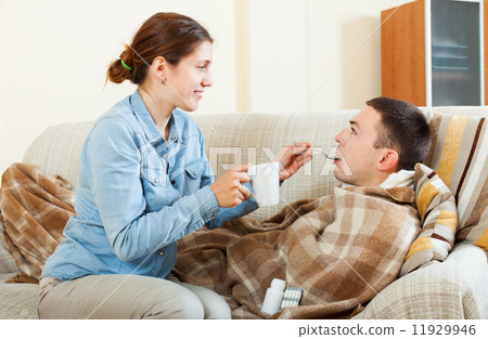Woman caring for sick man Woman caring for sick man 11929946
