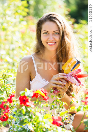 Woman gardening with roses Woman gardening with roses 11930159