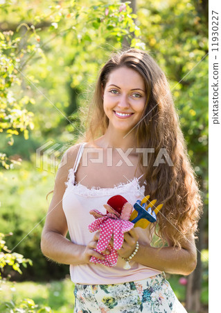 Smiling girl in garden Smiling girl in garden 11930227