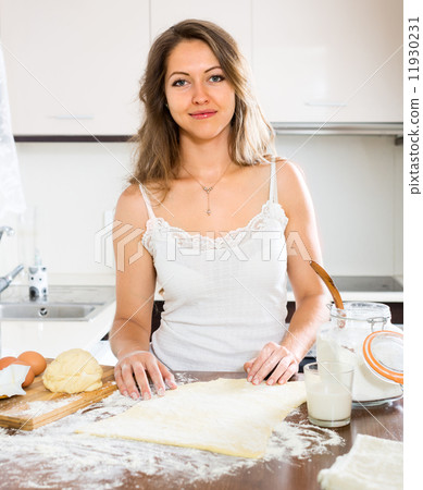 beautiful woman preparing cakes of dough beautiful woman preparing cakes of dough 11930231