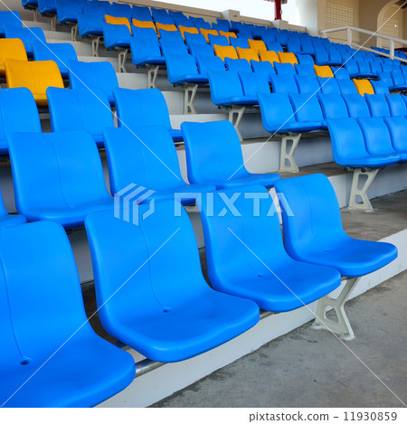 Empty bright blue stadium seats 11930859