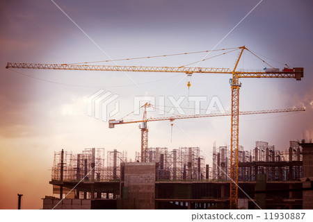 Construction site with cranes on sky background, retro tone imag Construction site with cranes on sky background, retro tone imag 11930887