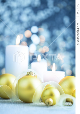 Christmas light blue background  with candles and baubles 11932889