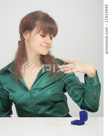 Young woman admires new jewel 11933648