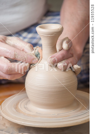 Hands of a potter Hands of a potter 11935528