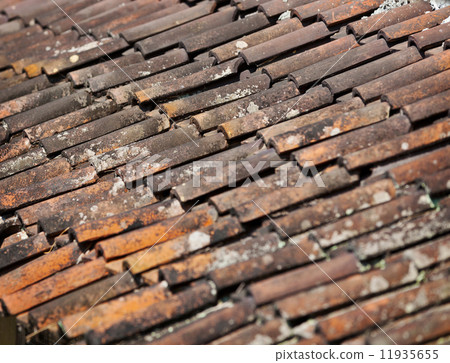 Old red weathered clay tiled roof surface Old red weathered clay tiled roof surface 11935655