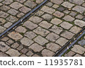 old tram rails on cobblestone 11935781