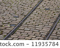 old tram rails on cobblestone 11935784