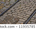 old tram rails on cobblestone 11935785