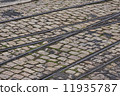 old tram rails on cobblestone 11935787
