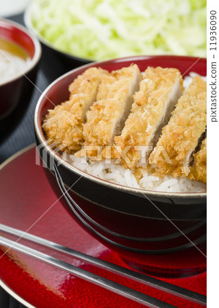 Tonkatsu - Japanese breaded, deep-fried pork cutlet on top of boiled rice. Tonkatsu - Japanese breaded, deep-fried pork cutlet on top of boiled rice. 11936090