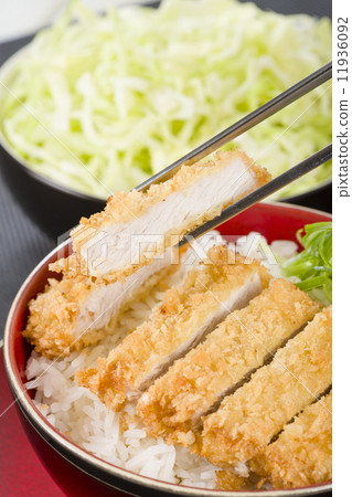Tonkatsu - Japanese breaded, deep-fried pork cutlet on top of boiled rice. Tonkatsu - Japanese breaded, deep-fried pork cutlet on top of boiled rice. 11936092