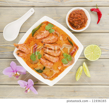 Tom Yum Nam Khon - Creamy Thai soup with prawns and mushrooms.  11936165