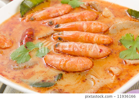 Tom Yum Nam Khon - Creamy Thai soup with prawns and mushrooms.  11936166