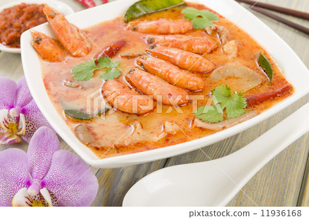 Tom Yum Nam Khon - Creamy Thai soup with prawns and mushrooms.  11936168