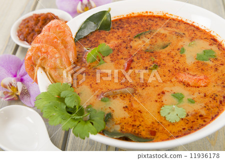 Tom Yum Nam Khon - Creamy Thai soup with prawns and mushrooms.  11936178