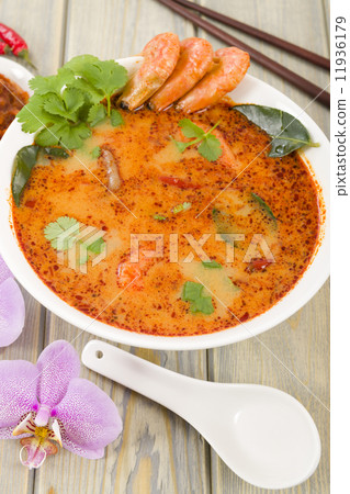 Tom Yum Nam Khon - Creamy Thai soup with prawns and mushrooms.  11936179