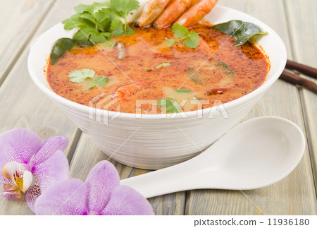 Tom Yum Nam Khon - Creamy Thai soup with prawns and mushrooms.  11936180