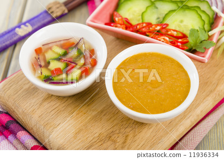 Satay Dips - Peanut sauce & Cucumber and onion relish Satay Dips - Peanut sauce & Cucumber and onion relish 11936334