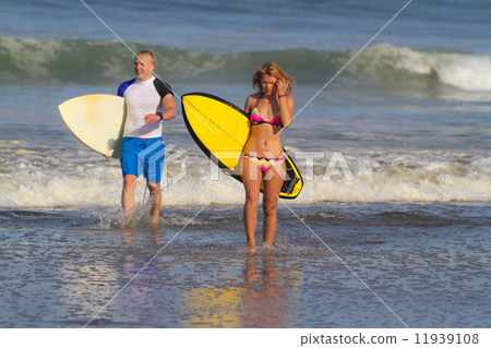 Surfers on Beach Having Fun in Summer. 11939108