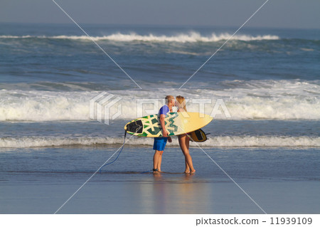 Surfers on Beach Having Fun in Summer. 11939109