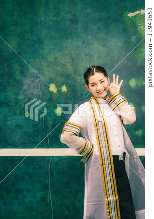 The female graduation portrait in academic gown is looking forwa The female graduation portrait in academic gown is looking forwa 11941651