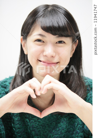 A woman who makes a heart A woman who makes a heart 11941747