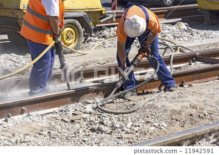 Two Workers with pneumatic hammer 11942591
