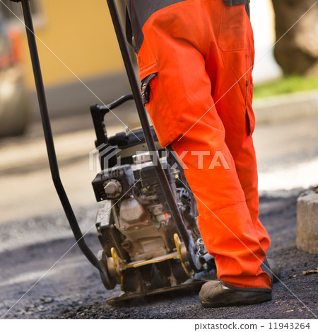 Asphalt surfacing manual labor. Asphalt surfacing manual labor. 11943264
