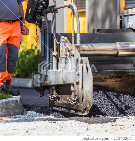 Asphalt surfacing manual labor. Asphalt surfacing manual labor. 11943265