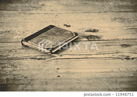 Old book on the wooden floor 11948751