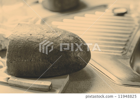 Half of bread in the kitchen 11948825