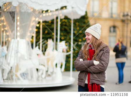 Girl on a Parisian street decorated for Christmas Girl on a Parisian street decorated for Christmas 11951138