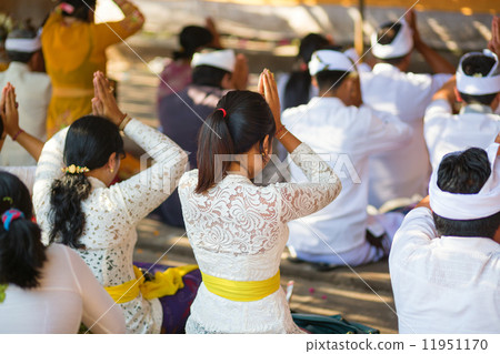 Young Balinese women praying in a temple Young Balinese women praying in a temple 11951170