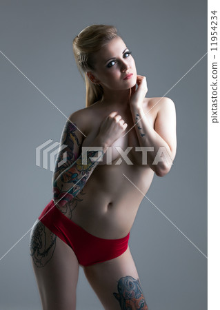 Busty tattooed girl posing in red panties 11954234