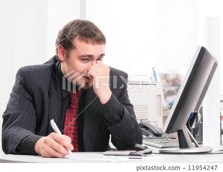 young businessman on workplace in office young businessman on workplace in office 11954247
