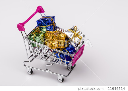 Christmas gifts in shopping trolley, isolated on white Christmas gifts in shopping trolley, isolated on white 11956514