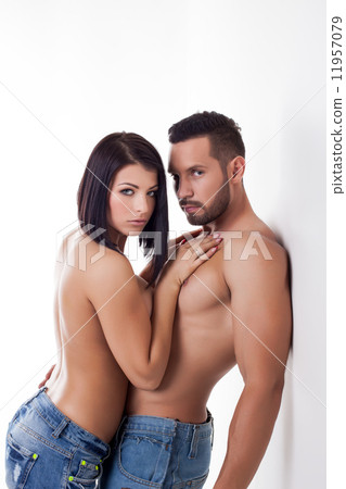 Couple of young handsome lovers posing at camera Couple of young handsome lovers posing at camera 11957079