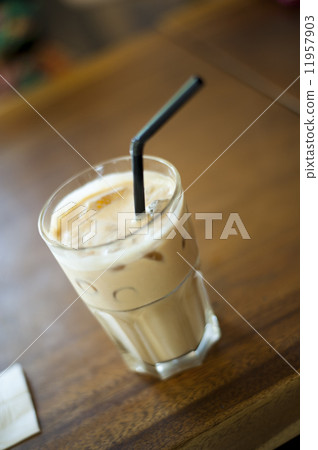 A glass of Cappuccino served on table. A glass of Cappuccino served on table. 11957903