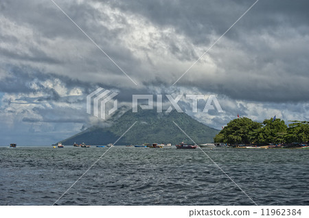 Volcano behind indonesian fishermen village tropical paradise Volcano behind indonesian fishermen village tropical paradise 11962384