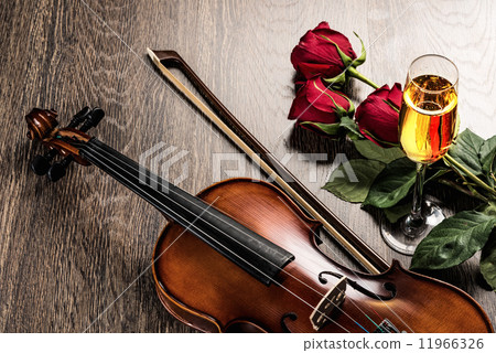 Violin, rose, glass of champagne and music books Violin, rose, glass of champagne and music books 11966326