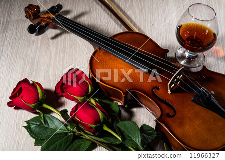 Violin, rose, glass of champagne and music books Violin, rose, glass of champagne and music books 11966327