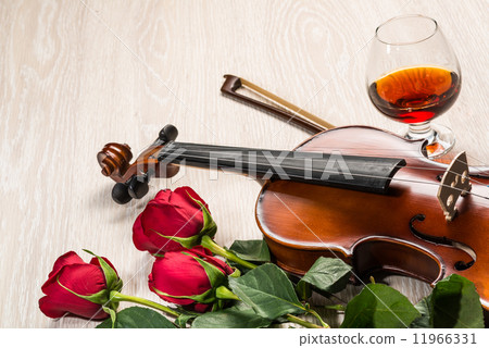 Violin, rose, glass and music books Violin, rose, glass and music books 11966331