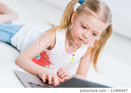Pretty girl working on a laptop 11966947