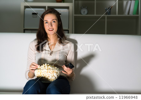 young woman watching TV young woman watching TV 11966948