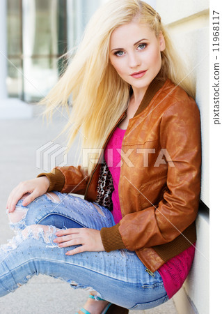 Nice blonde girl is wearing autumn clothes Nice blonde girl is wearing autumn clothes 11968117