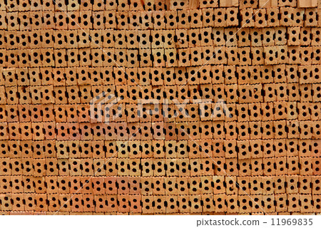 Stack of red bricks, bricks used for building construction 11969835