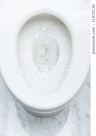 A flush view of flushing toilet water 11970136