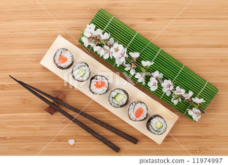 Sushi maki set with fresh sakura branch 11974997
